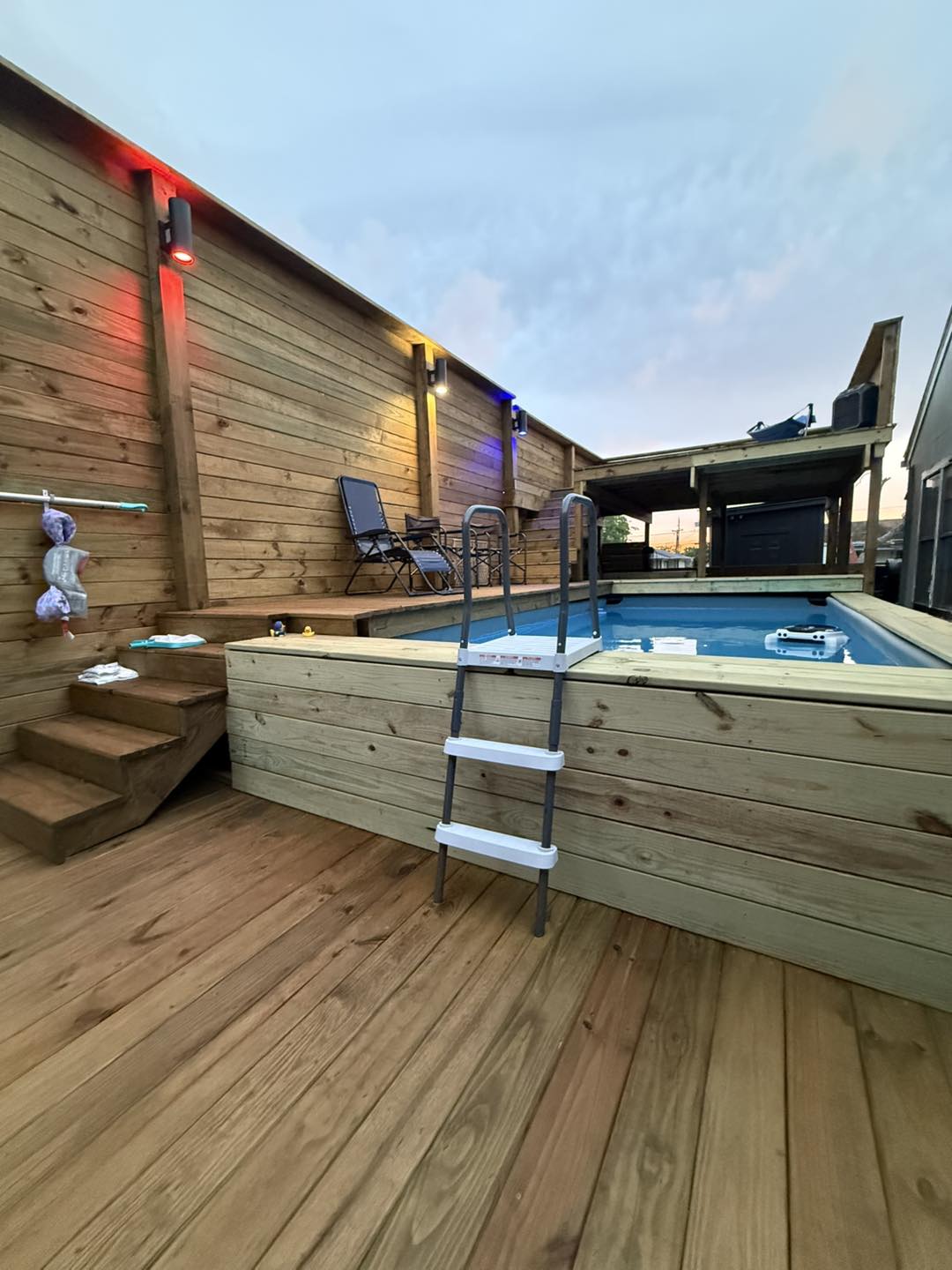 Backyard deck build with pool surround and cedar privacy wall