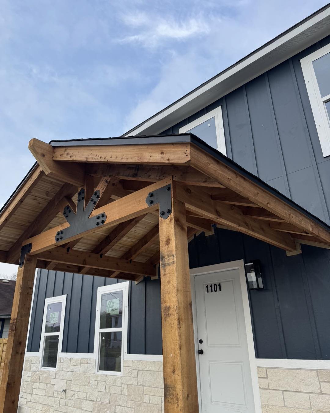 Timber-frame entry porch built by Custom ABC
