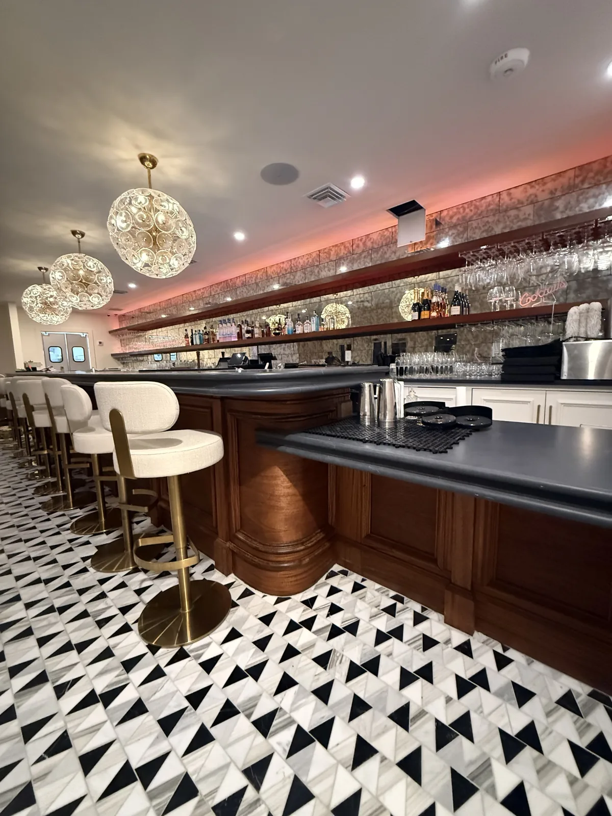 Curved mahogany bar millwork built for Bien Merité, stained and finished
