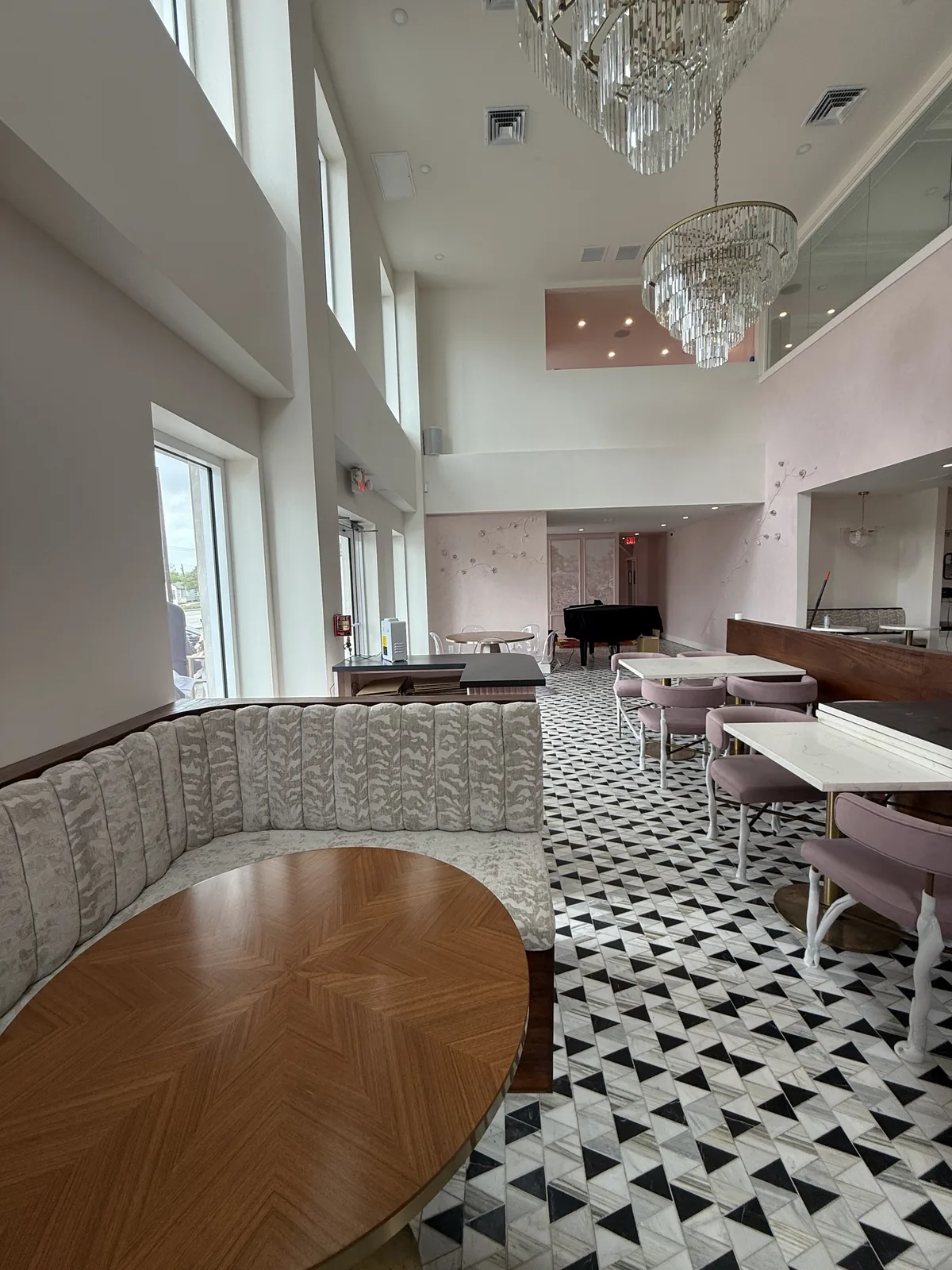 Curved banquette booth with custom parquet table top